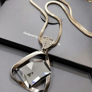 Elegant Gold Necklace with Charcoal Gem Pendant